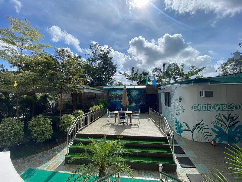 Garden steps and lounge area at the resort entrance