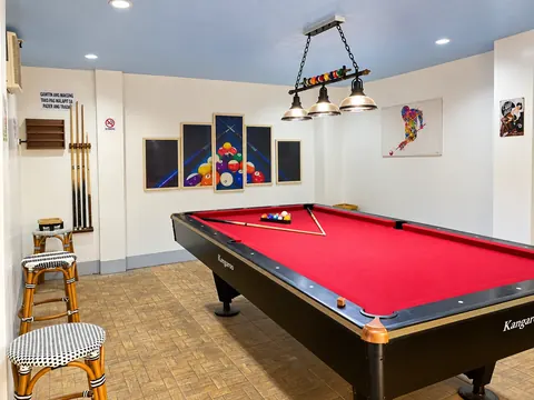 The game room with a billiard table