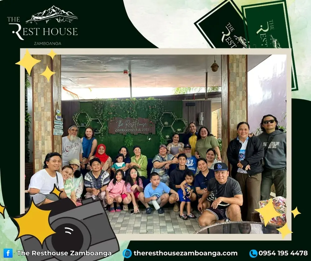 A multi-generation family posing together at the resort lounge