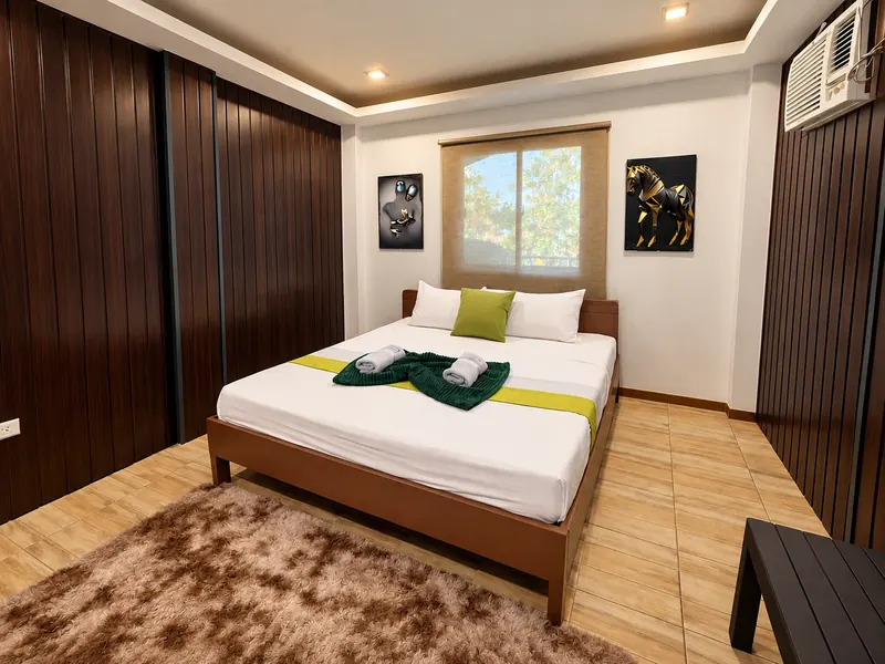 A guest room with a queen bed